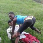 Lovebirds caught making out on the grass