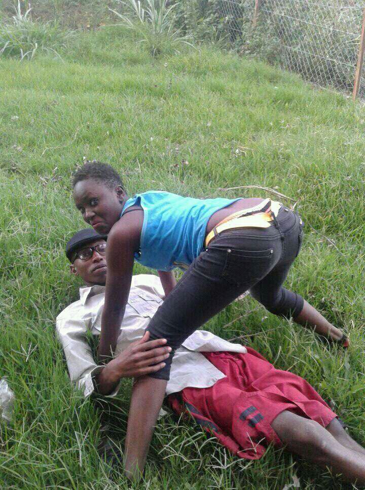 Lovebirds caught making out on the grass