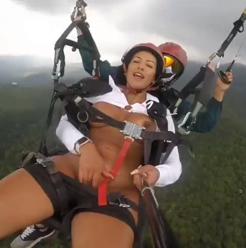 Woman masturbates while on a parachute in the air