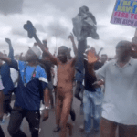 Nigerian anti-government protester strips naked, swings his dick in rage