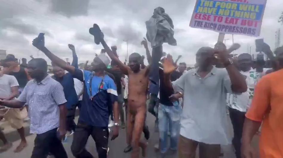Nigerian anti-government protester strips naked, swings his dick in rage