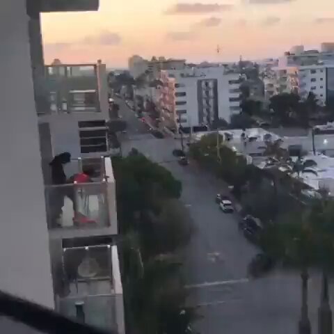 Naughty couple caught fucking in broad daylight on their balcony