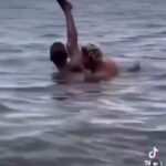 Crazy banger violently fucks woman in the ocean while lifting her leg up in the air