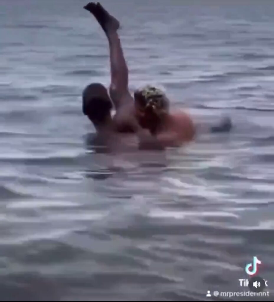 Crazy banger violently fucks woman in the ocean while lifting her leg up in the air