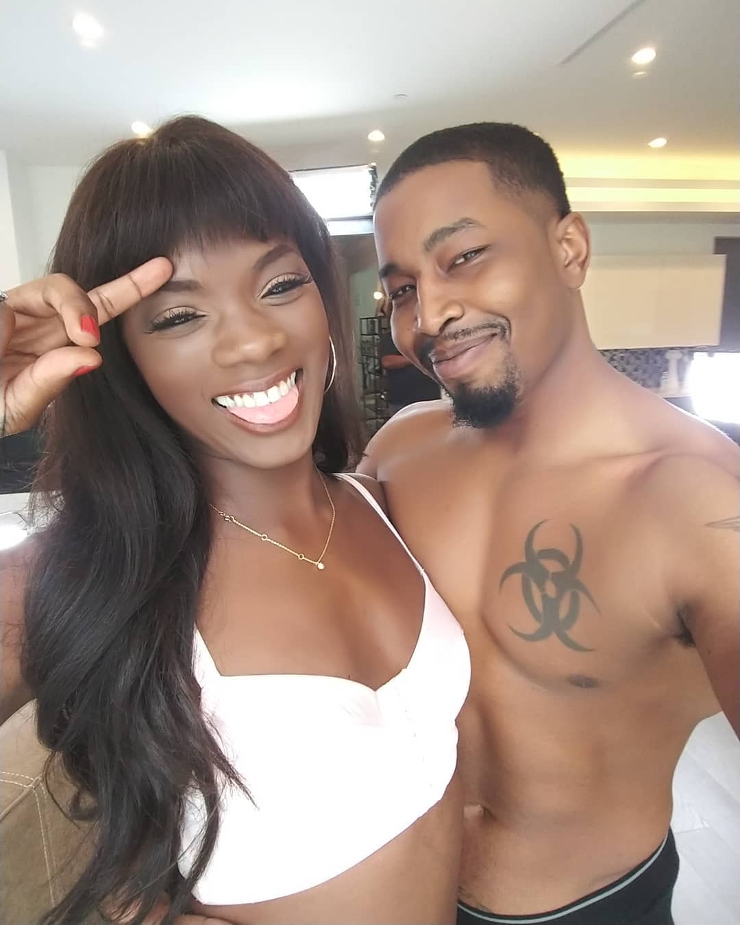 Isiah Maxwell with Ana Foxxx on set